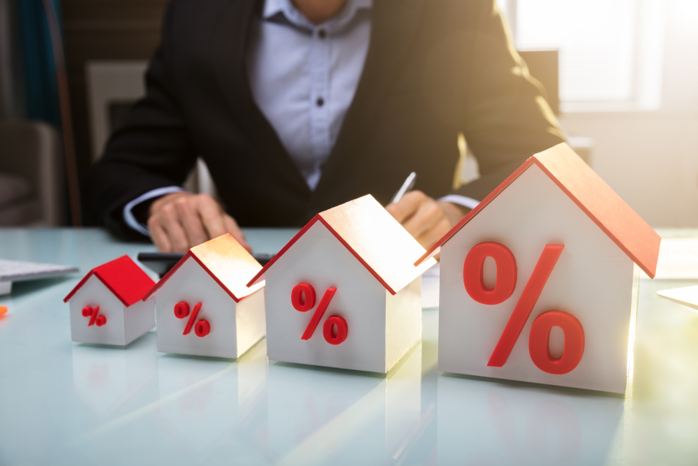 an image of houses with percentage signs to denote a story about average mortgage rates